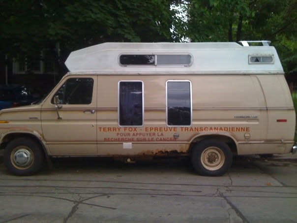 A van lettered 'Terry Fox – Épreuve transcanadienne' parked on a residential Toronto street