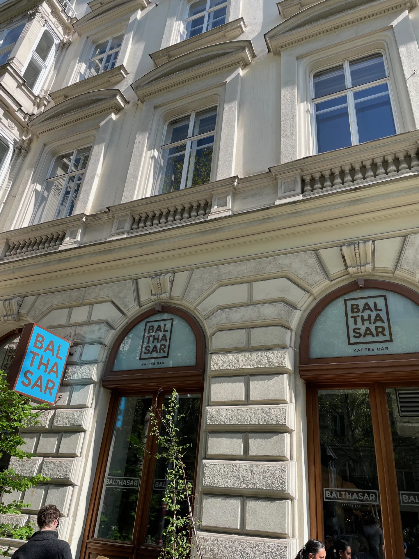 The Balthasar Kaffee Bar sign on a grand Viennese façade